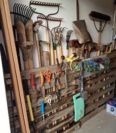 a bunch of tools are hanging on a wall