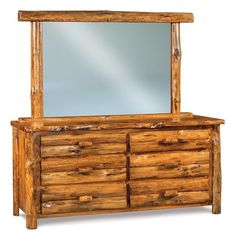 a large wooden dresser with a mirror on it's top and bottom drawers below