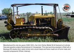 an old yellow bulldozer sitting in the grass