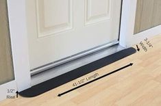 the door mat is on the floor next to the front door with measurements for it