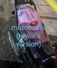 a motorcycle with a face painted on the side and words above it that read, motoman taylor's version