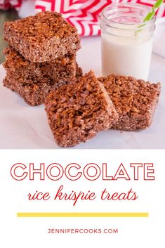 chocolate rice krispie treats are stacked on top of each other with a glass of milk in the background