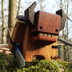 a wooden toy that looks like a dog in the woods