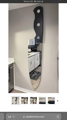 a mirror that is on the wall above a stove top oven in a home kitchen