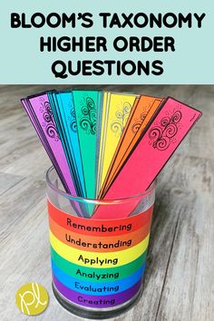 a cup filled with colorful cards and the words bloom's taxionyy higher order questions