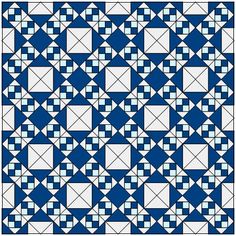 a blue and white quilt with squares in the center, on top of it is a square