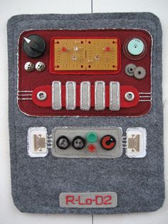 a close up of a cell phone case with buttons and other things on the back