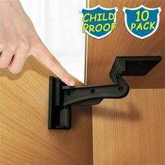 a person is opening the door with their thumb and pulling it out from behind them