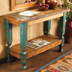 a wooden table sitting in front of a mirror