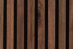 closeup of wooden slats on a wall with dark wood grains in the background