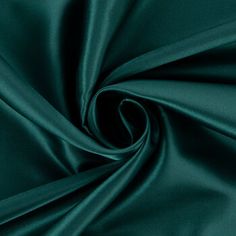 Add an element of elegance to your sewing creations with Dark Green Poly Satin Fabric! Featuring a solid dark green color and a sleek top surface, this fabric is fit for a wide range of creations. This simply stunning satin will make you shine with sophisticated style! Details: 	 Width: 58" 	 Weight: Very Lightweight 	 Country Of Origin: China 	 Content: 100% Polyester 	 Care: Machine Wash, Warm; Delicate Cycle; Tumble Dry, Low; Use Cool Iron; Do Not Bleach 	 Flammability Note: Not For Sleepwear Sleek Green Dress, Sage Green Satin Fabric, Elegant Silk Fabric With Satin Finish, Branding 2023, Green Satin Fabric, Dark Green Fabric Texture, Dark Green Fabric, Oxidised Jewelry, Prom Nail