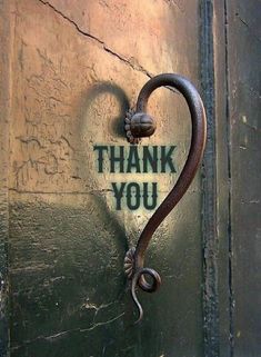 a heart shaped door handle with the words thank you written on it