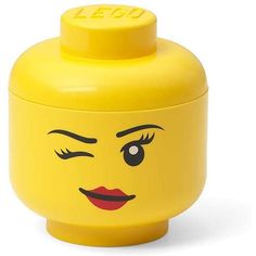 a yellow plastic container with a face on it