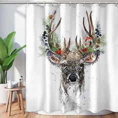 a shower curtain with an image of a deer's head and antlers on it