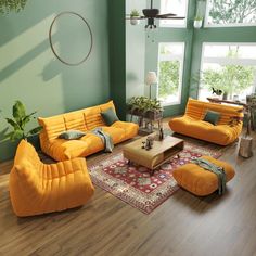 a living room with green walls and yellow couches, rugs and coffee table