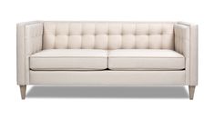 a white couch sitting on top of a wooden frame