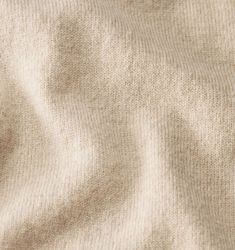 an image of the texture of a sweater that looks like it is made out of wool