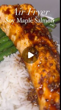 a plate with rice, asparagus and salmon on it that says air fryer soy maple salmon