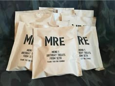 five bags that are sitting on the ground together, all labeled in different font and numbers