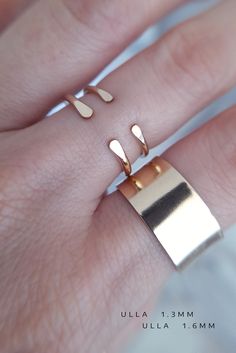 "♦ This is a PREORDER which ships out in 1-3 weeks ♦ [ Listing is for One Ring ] Simple, solid 14K yellow gold open cuff ring wear alone or stack 2 or 3 for texture perfect everyday ring. ► 14K Gold ring is about 1.3mm thick(slim) // This style can be customized // Thickness: 1.3mm, 1.6mm, 2mm Gap Width: 2mm - 7mm Metal: 14k Yellow Gold, 18k Yellow Gold, 10K Yellow Gold, 14K Rose Gold, 18K Rose Gold, 14K White Gold Please convo me with ring size & desired specifications for a price quote. ♦ ♦ ♦ Minimalist Open Band Jewelry For Promise, Minimalist Open Band Promise Jewelry, Modern Stackable Midi Rings For Promise, Minimalist Double Band Stackable Promise Rings, Stackable Rose Gold Open Band Midi Rings, Stackable Rose Gold Midi Rings With Open Band, Minimalist Open Band Midi Ring For Promise, Rose Gold Stackable Midi Rings With Open Band, Minimalist Hypoallergenic Open Band Jewelry