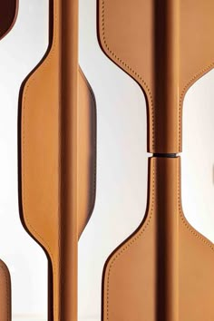 the inside of a brown leather case with two compartments and one door open to reveal an electronic device