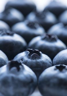 blueberries are sitting together on the table