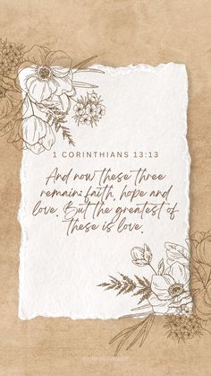 a piece of paper with flowers on it and the bible verse written in brown ink