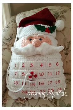 a crocheted santa claus pillow on a chair