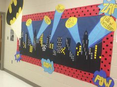 a bulletin board with batman decorations on it