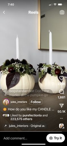 two white pumpkins decorated with flowers and candles