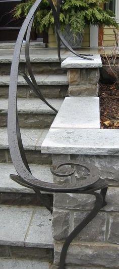 a bench sitting on top of stone steps