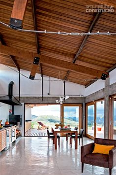 an open living room and dining area with sliding glass doors that lead out to the outdoors