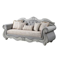 a gray couch with pillows on top of it