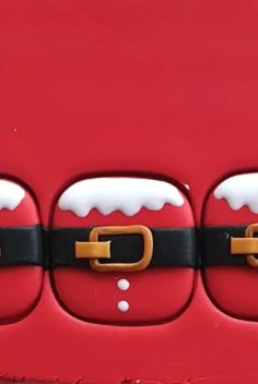 a close up of a red and black santa clause door handle