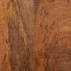 closeup of wood grains on the surface of a piece of wooden flooring