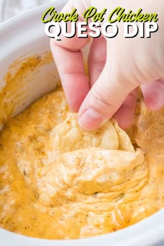 a hand dipping a tortilla chip into a bowl of quesadilla dip