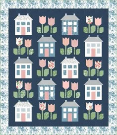 a quilt pattern with houses and flowers on the front, along with tulips