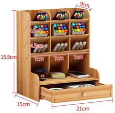 the wooden desk organizer has compartments for pens and pencils on it, along with two drawers