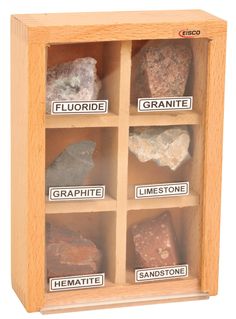 a wooden box with rocks in it and labels on the sides that read granite, granite, granite, lime stone