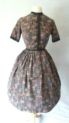 Vintage Dress 1950's Vintage Day Dress Brown Cotton Print Buttons to the waist Black Braided Trim Along the Neck, Front, Waist and Sleeves Bodice is fitted with side seam and bottom bodice darts the skirt is Pleated all the way around for a Full Gather I have it shown with and without a Crinoline, which is Not included The only tag is the size tag, which I can't read, so Please go by measurements taken laid flat seam to seam 19" armpit to armpit 11 1/2" waist 16" shoulder to waist 24 1/2" waist 1950s Christmas Dress, Bodice Darts, Shirt Waist Dress, Vintage Day Dress, Rockabilly Shirts, 40s Dress, Flat Seam, Fashion 1950s, Shirtwaist Dress