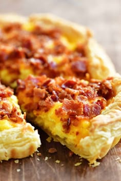 a bacon quiche on a wooden cutting board