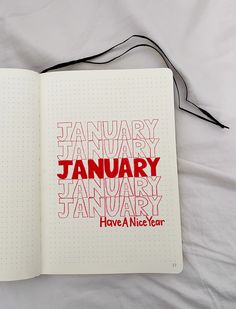 an open notebook with the words january and have a nice year written in red on it