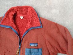 For sale is a vintage Patagonia Reverse Pile fleece jacket.  This jacket is in good gently used condition with holes or stains, part of the velcro seam on the chest pocket is loose but the velcro is intact and functional (see pictures).  Nice thick material, hand pockets and a chest pocket, rare and hard to find.   Patagonia, 100% Polyester and Nylon trim, Large, made in USA.  Thanks!   pit to pit: 23.5   length: 28  arm from center of collar: 34 Retro Patagonia, Hip Hop Street Fashion, Mountain Gear, Fishing Jacket, Hiking Winter, Orange Jacket, Vintage Patagonia, Snow Fashion, Rap Tee