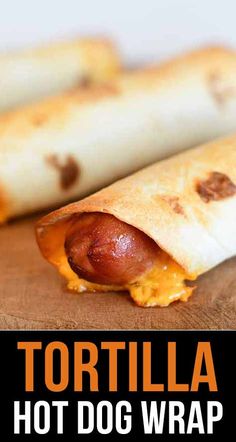 two hot dogs wrapped in tortilla bread on a cutting board with text overlay that reads tortilla hot dog wrap