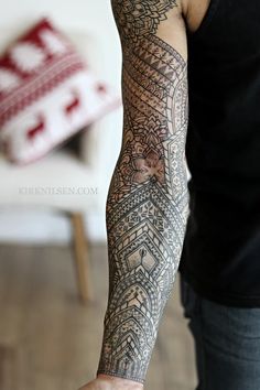 a man with a tattoo on his arm