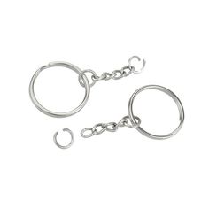 two silver metal handcuffs on a white background