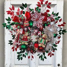 a door decorated with christmas decorations and candy canes