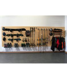 there is a wall mounted rack with many items on it