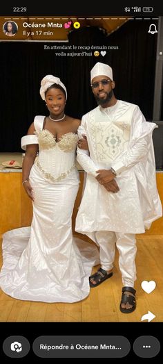 a man and woman dressed in white standing next to each other on a wooden floor