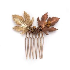 Drawing inspiration from the enchanting colors of autumn, this mini comb adds an elegant touch to any ensemble.  Crafted with a beautiful mix of antique gold and vintage rose gold-plated maple leaves, along with shimmering crystals, this comb reflects the rich warmth of fall through its intricate detailing. Each leaf is carefully hand-wired onto a golden comb, capturing the essence of autumn's vibrant landscape. Ideal for both special events and daily wear, this little comb captivates with its beauty, making it an excellent gift for nature enthusiasts or anyone who appreciates the splendor of the fall season. Style C059 - Caramel Maple Comb Artfully hand-wired for enduring support, ensuring a timeless and steadfast elegance that stands the test of time with every graceful wear. Each of our Hair Accessories Vintage, Gold Hair Comb, Gold Headpiece, Artistic Wire, Vintage Rose Gold, Rose Vintage, Boho Fall, Antique Roses, Maple Leaf